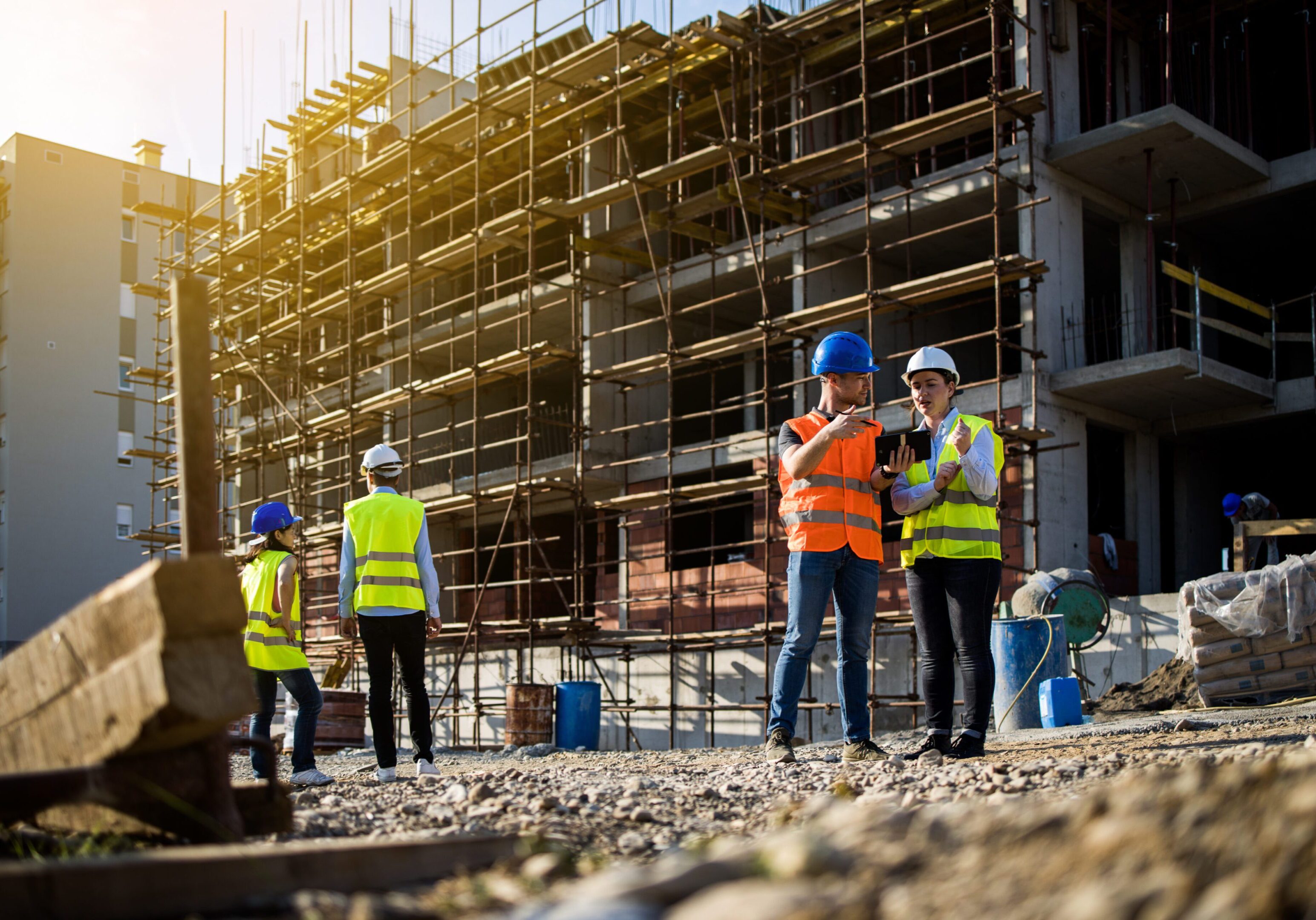 Four construction workers having meeting